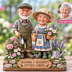 May include: A figurine of an elderly couple in a garden setting. The man wears a flat cap and overalls, holding a trowel. The woman wears a straw hat and floral apron, holding a basket of flowers. A sign reads GRANDMA & GRANDPA'S COTTAGE GARDEN.