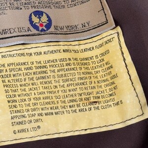 Chaqueta de aviador vintage AVIREX A-2 de cuero, fabricada en EE. UU., color marrón desgastado, talla M para hombre. imagen 12