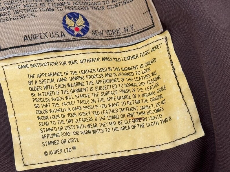 Chaqueta de aviador vintage AVIREX A-2 de cuero, fabricada en EE. UU., color marrón desgastado, talla M para hombre. imagen 12