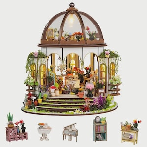 May include: A miniature dollhouse greenhouse with a glass dome roof, filled with tiny plants and flowers. The structure has multiple levels and is surrounded by miniature furniture and accessories. The scene is illuminated by a small light inside the dome.