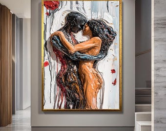 May include: A framed artwork depicts an embracing couple in a textured, three-dimensional style. The figures are rendered in shades of black, red, and orange against a white and gray background, with a gold frame. The artwork evokes a sense of intimacy.