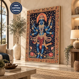 Pode incluir: Uma impressão de arte de parede retangular em tela 100% algodão, apresentando uma divindade de pele azul com múltiplos braços, joias douradas ornamentadas e uma coroa. A figura destaca-se num fundo azul escuro com detalhes florais e uma borda decorativa.