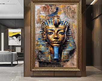 May include: A framed painting depicting a bust of an Egyptian pharaoh. The pharaoh's face is gold with blue and gold headdress and collar. The background features hieroglyphs and a textured, aged appearance. The frame is gold.