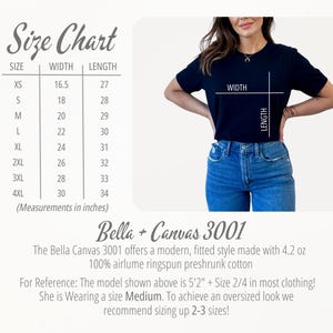 May include: A size chart with measurements in inches for XS to 4XL t-shirts. The chart shows width and length measurements. A woman models a black t-shirt and blue jeans. The text reads "Bella + Canvas 3001".