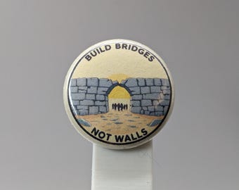 Build Bridges Not Walls – 1" Button (Design 3.1) – People Over Borders Series