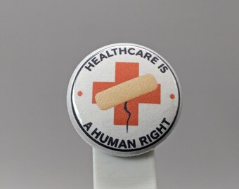 Healthcare Is a Human Right – 1" Button (Design 1.4) – People Over Profit Series
