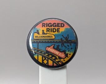 Rigged Ride: The Unequal Track – 1" Button (Design 4.1) – Power & Corruption Series