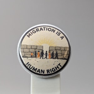 Migration is a Human Right – 1&quot; Button (Design 2) – People Over Borders Series