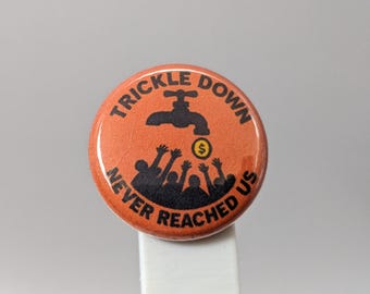 Trickle Down Never Reached Us – 1" Button (Design 5.2) – Power & Corruption Series