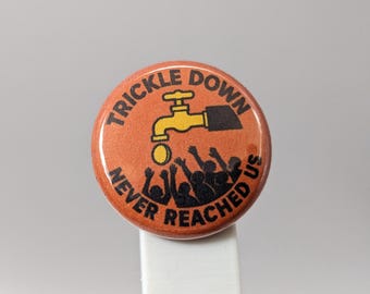 Trickle Down Never Reached Us – 1" Button (Design 5.1) – Power & Corruption Series