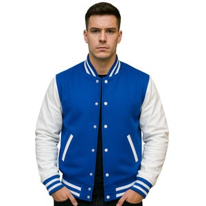 May include: A royal blue varsity jacket with white sleeves and white stripes on the cuffs and collar.