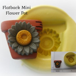 May include: A miniature terracotta-colored flower pot with a gray sunflower design. The flower has a yellow center. The image also shows a yellow mold with a sunflower and flower pot design. Text on the image reads: Flatback Mini Flower Pot.
