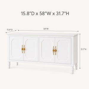 May include: White cabinet with four doors, gold hardware, and decorative molding. The cabinet is 58" wide, 31.7" high, and 15.8" deep. It has four decorative legs.