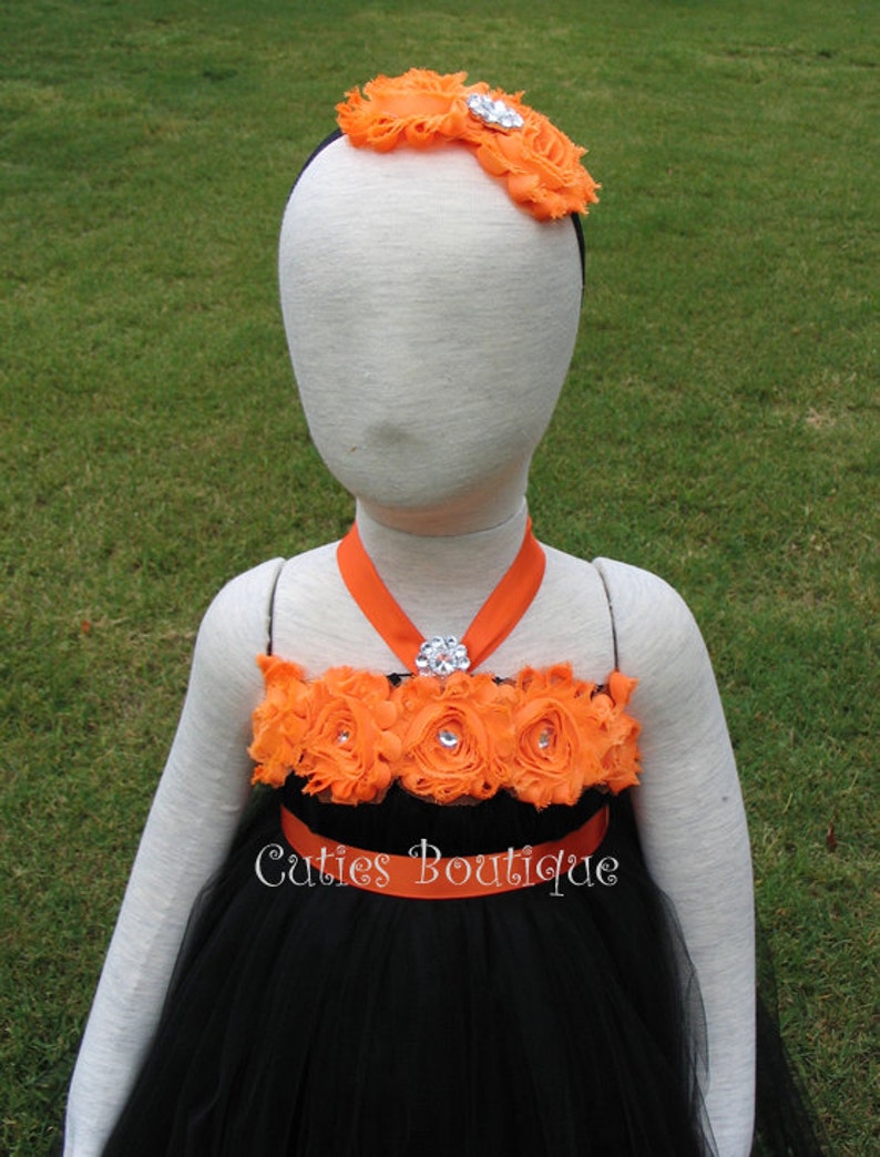 black dress with orange flowers