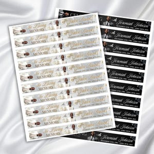 May include: Sheets of memorial labels with the text "In Loving Memory" and names like "Jalen Brooks" and "Jeremiah Johnson" printed on them. The labels feature floral and dove graphics, with dates of birth and death.