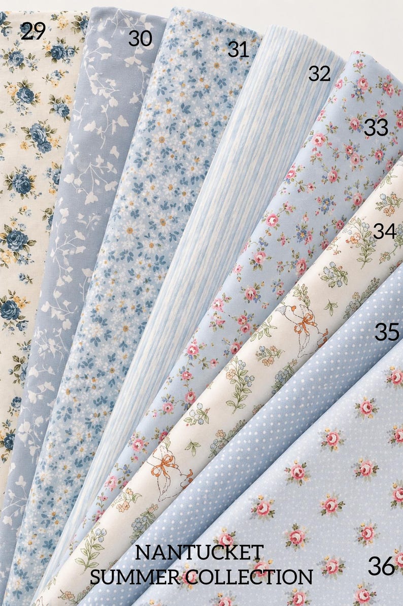 May include: A collection of eight fabric swatches labeled 29 through 36, featuring various patterns including blue and yellow floral prints, white line drawings, vertical stripes, and white polka dots on light blue and cream backgrounds.