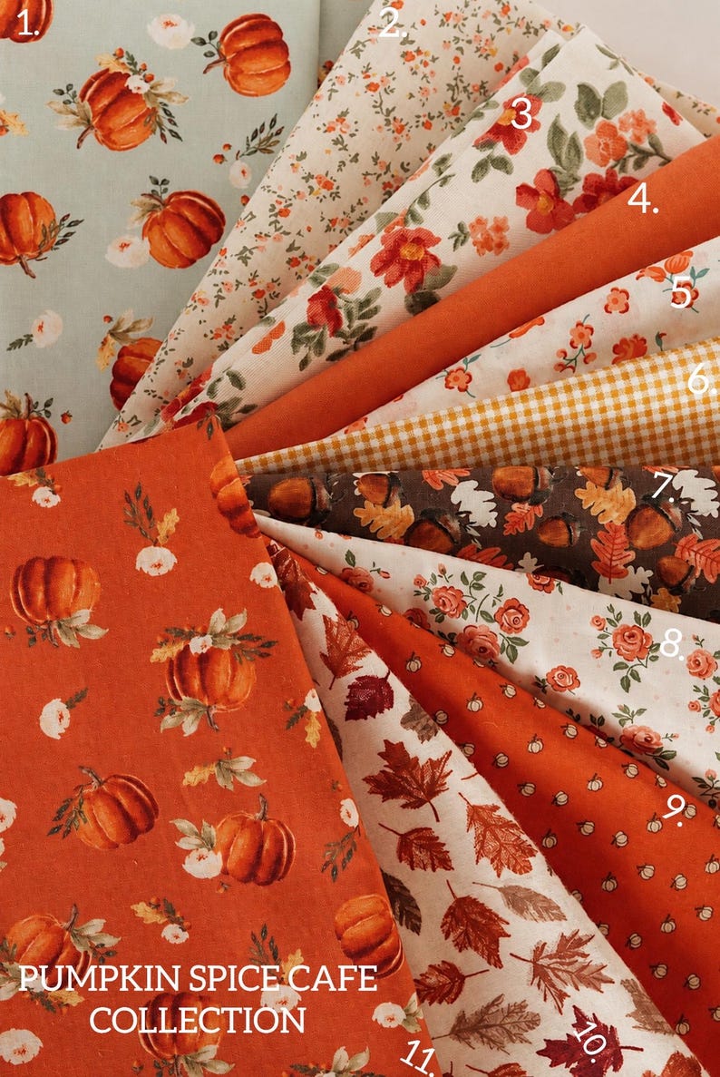May include: A collection of eleven fabric swatches featuring autumn-themed patterns including pumpkins, floral prints, gingham, acorns, and fall leaves in shades of orange, brown, cream, and sage green, labeled Pumpkin Spice Cafe Collection.