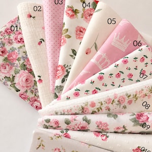 May include: A collection of eleven fabric swatches labeled 01 through 11, titled COTTAGECORE GIRLHOOD COLLECTION. The fabrics feature various patterns including pink roses, small pink polka dots, white crowns on pink, and floral prints on white and beige backgrounds.