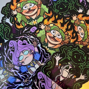 May include: A selection of vibrant stickers displaying cartoon characters in diverse designs. The stickers feature characters with green, purple, and orange skin tones, set against black and glittery backgrounds. The characters have expressive faces and are in dynamic poses.