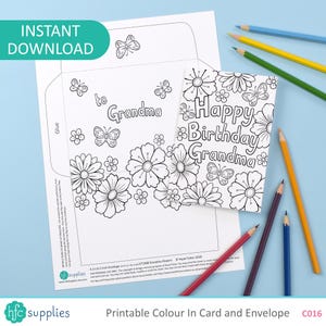 May include: Printable black and white card and envelope set with floral and butterfly designs. The card reads "Happy Birthday Grandma." The envelope says "to Grandma." Colored pencils are scattered around the card.
