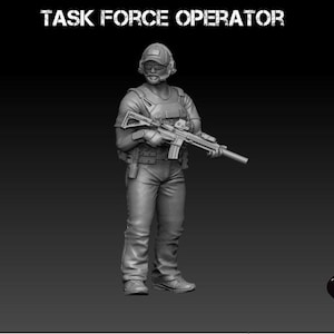 May include: A grayscale figurine of a Task Force Operator holding a rifle. The figure is wearing a helmet, tactical vest, and pants. The text "TASK FORCE OPERATOR" is above the figure. The Black Hills Games logo is in the bottom right corner.