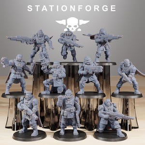 May include: A collection of gray miniature figurines of soldiers in futuristic armor, each holding a weapon. The figurines are on individual black bases, with the text "STATIONFORGE" and a skull logo at the top.
