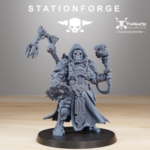 May include: A gray miniature figure of a hooded character with a skull-like face, holding mechanical tools and a circular saw-like device. The figure is standing on a black base. The text "STATIONFORGE" is at the top.