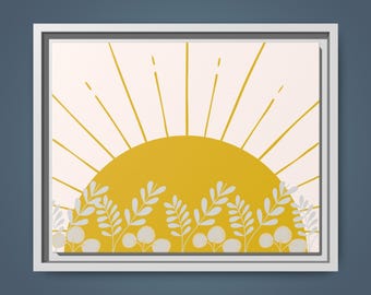 Puede incluir: Una impresión artística enmarcada con un sol amarillo estilizado y líneas radiantes sobre un fondo crema. La parte inferior de la imagen tiene elementos florales blancos y grises. El marco es blanco.