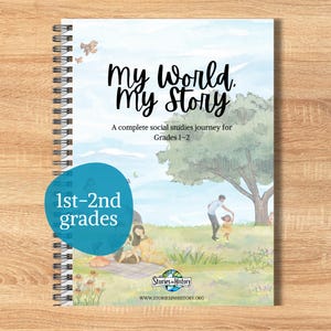 May include: Spiral-bound book titled "My World, My Story" for grades 1-2 social studies. The cover features a watercolor illustration of a park scene with a family. A blue circle indicates "1st-2nd grades". The book is from "Stories in History".