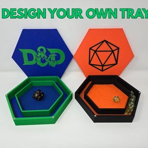May include: Hexagonal gaming trays in green and black, with blue and orange felt inserts. The trays are designed to hold dice and other gaming accessories. The image also shows blue and orange hexagonal backdrops with D&D and geometric designs. Text reads: DESIGN YOUR OWN TRAY!!