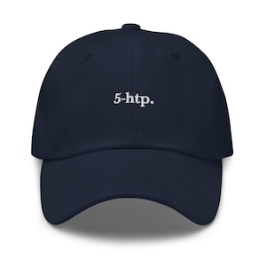 May include: Navy blue baseball cap with the embroidered text "5-htp." The cap has a curved brim and a six-panel design. The text is in a simple, sans-serif font.