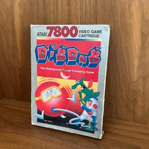 Vintage Dig Dug video game cartridge for the Atari 7800 complete in box, retro gaming, retro computing, vintage video games