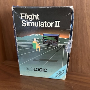 Flight Simulator II for the Commodore 64 in original box with manuals, maps, and diskette. 1980s gaming, vintage computing, retro computing