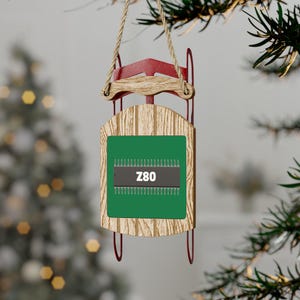 Retro-Rechenschlitten-Verzierung mit einem 40-Pin Z80-CPU-Chip, der Vintage-Elektronik und Computer aus den 1980er Jahren feiert