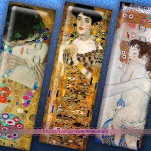 May include: Rectangular art prints featuring details from Gustav Klimt paintings. The prints showcase gold, yellow, and blue hues, with depictions of figures in various poses. The prints have a glossy finish and are set against a blue background.