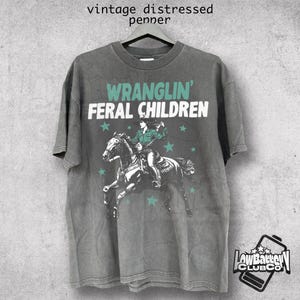 Wranglin&#39; Feral Children T-Shirt, Vintage 90s Western Raccoon Tee, Retro Funny Meme Shirt, Washed Cowboy Graphic, Teenager Gift Tee