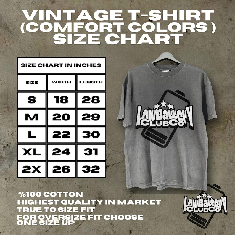 May include: Gray vintage t-shirt with the text "LowBattery CLUBCO" and a battery graphic. The size chart in inches is displayed, with measurements for sizes S to 2X. Made of 100% cotton.