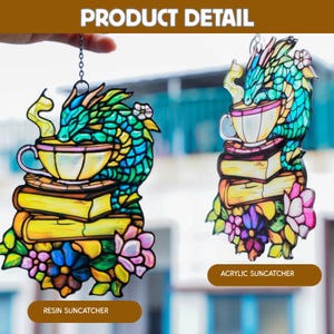 May include: Two suncatchers featuring a dragon design. The dragon is green and teal, sitting on a stack of books and a teacup. The suncatchers are decorated with flowers and the text "Resin Suncatcher" and "Acrylic Suncatcher".