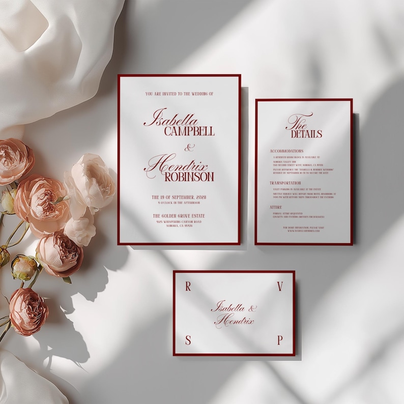May include: Wedding invitation suite featuring a main invitation, details card, and RSVP card. The text is in a burgundy color with a serif font. The main invitation reads "Isabella Campbell & Hendrix Robinson". The suite is on a white background.