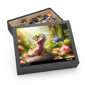 May include: A 120-piece 8x10 puzzle featuring a colorful gecko with a flower crown sitting on a rock in a garden setting. The puzzle is recommended for ages 9 and up.