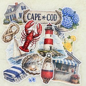 May include: A collection of nautical-themed stickers featuring a Cape Cod wooden sign, a red lobster, a red and white lighthouse, a sailboat, a blue and white striped towel, a pearl in an oyster shell, blue hydrangeas, and a glass of lemonade.