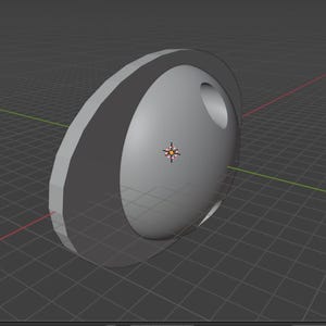 May include: A 3D-rendered, gray, circular object with a dark gray band around the edge and a hole on the side. The object is set against a grid background with red and green lines.