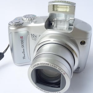 Canon PowerShot SX100 IS 8.0MP 10fach Zoom Digitalkamera mit 4GB SD Karte | FUNKTIONIERT