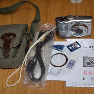 Canon PowerShot A1100 IS 12.1MP kompakte Digitalkamera Silber getestet Box SD Karte