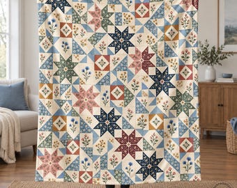 May include: A rectangular quilt featuring a repeating patchwork pattern of eight-pointed stars and floral motifs in shades of navy blue, sage green, dusty rose, and cream. The design consists of alternating geometric star blocks and squares.