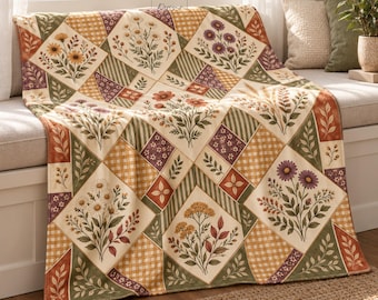May include: A quilt featuring a diamond-patterned patchwork design with alternating squares of floral illustrations and gingham prints in shades of cream, olive green, rust orange, and purple, with the text NG Designs at the top center.