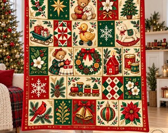 May include: A rectangular throw blanket featuring a grid of Christmas-themed illustrations including teddy bears, a rubber duck, a rocking lamb, a train, a wreath, bells, a cardinal, poinsettias, snowflakes, and gifts in red, green, and cream.