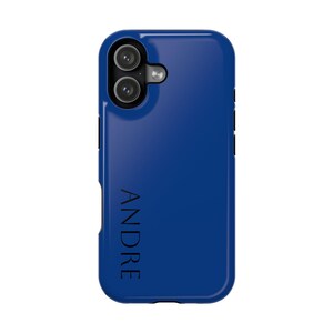 May include: A cobalt blue phone case with a dual-lens camera cutout. The word "ANDRE" is printed vertically in black on the case. The case has a smooth, glossy finish and is designed to fit a smartphone.