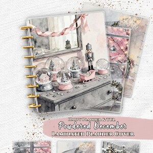 May include: A set of laminated planner covers for Happy Planner and TUL systems, featuring the text "Powdered December". The designs display watercolor-style winter scenes including snow globes, a nutcracker, a sleigh, a staircase, and a mailbox.