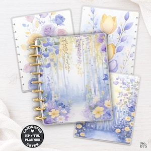 May include: Four laminated planner covers featuring watercolor illustrations of floral gardens, birch trees, and a picket fence in shades of yellow, purple, and blue. The covers have gold-colored disc-bound spines and a circular black label with white text.